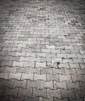 Paving stone on the road as a background .