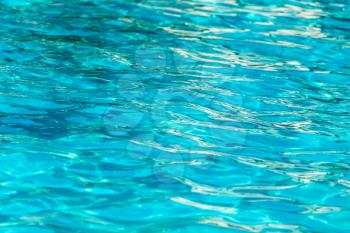 The smooth water in the pool as a background .