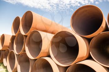 large rusty metal pipes as a background .
