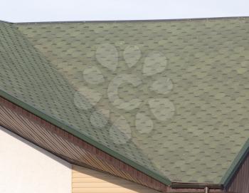 Roof of house with green tiles