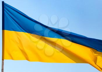 flag of Ukraine against the blue sky .