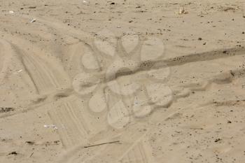 footprints in the sand on cars