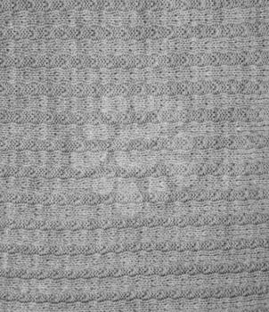 Grey knitted wool close up