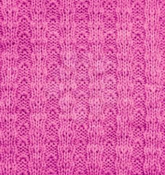 pink knitted fabric as a background. macro