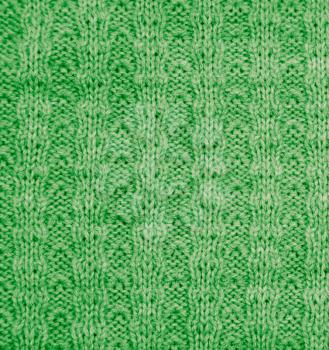 green knitted fabric as a background. macro
