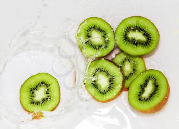 kiwi fruit in water on a white background