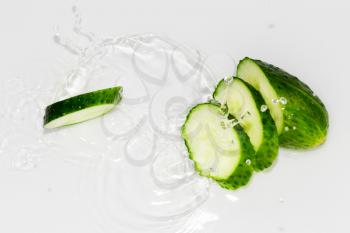 cucumber in the water on a white background