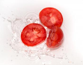 tomato in water on white background