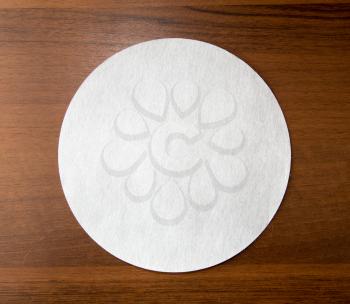 white sheet of paper on wooden background