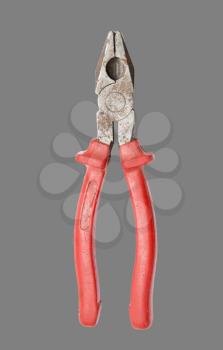 red pliers on a gray background