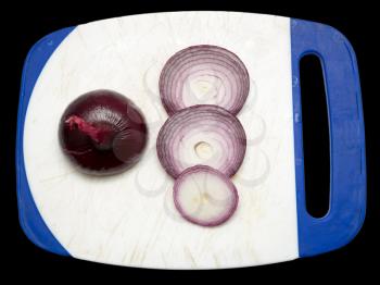 sliced red onion on a black background