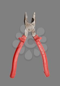 red pliers on a gray background