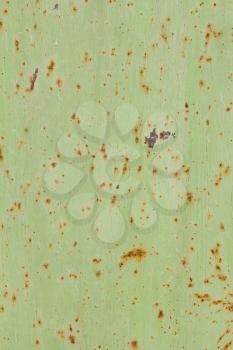Background of rusty metal, painted in green