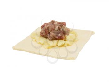 dough with meat on a white background