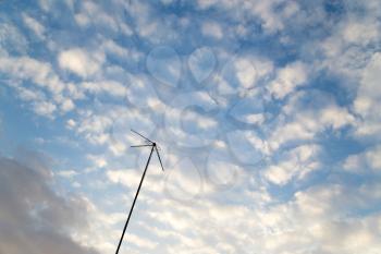 antenna on a background of the sky with clouds