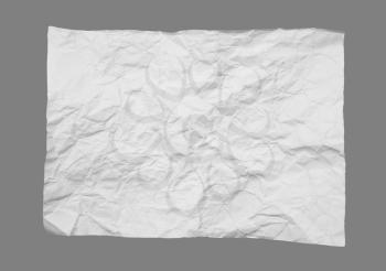crumpled white paper on a gray background