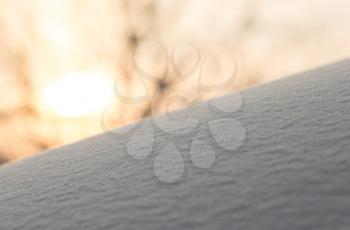 background of snow in the dawn sun