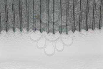 Snow on fence