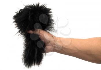 black fur in his hand on a white background