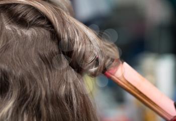 wrap curling hair in a beauty salon