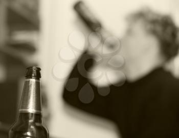 bottle of beer on background, beer drinker