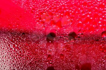 Abstract background of water drops on a red background