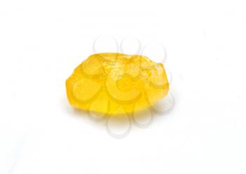 yellow candy on a white background. macro