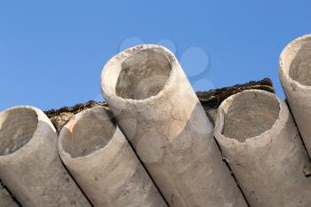 asbestos cement pipes against the blue sky