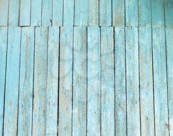 wooden background with old blue paint