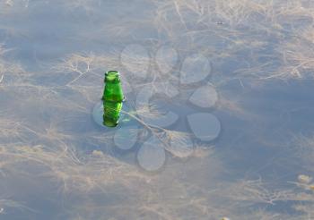 bottle of water in the lake