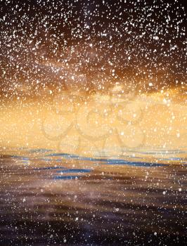sunset over the sea with snow
