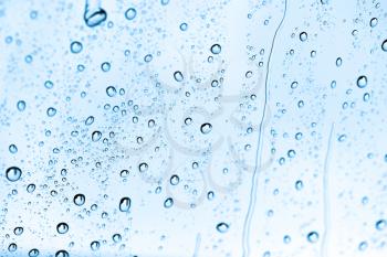 water drops on blue glass