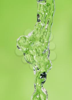 a jet of water on a green background