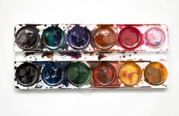 watercolor paints on a white background