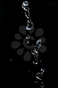 stream of water on a black background