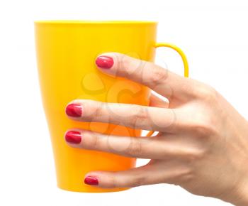 yellow glass in hand with red nail polish on a white background
