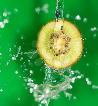Kiwi in water on a green background