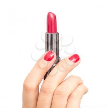 red lipstick in hand with red nail polish on a white background