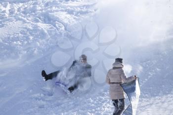 people on a sled
