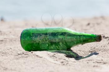 glass bottle in the sand