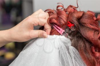 Wedding hairstyles with veil in the beauty salon