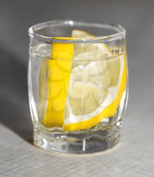 lemon in a glass of vodka