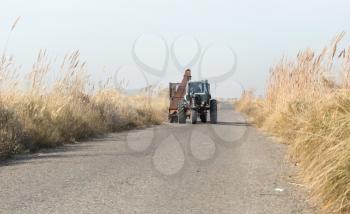 tractor on the road with a cane