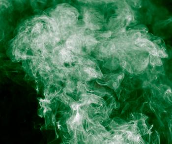 green smoke on a black background
