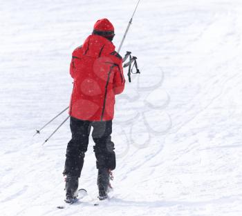 people skiing in the snow in the winter