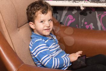 Boy playing on tablet, indoor
