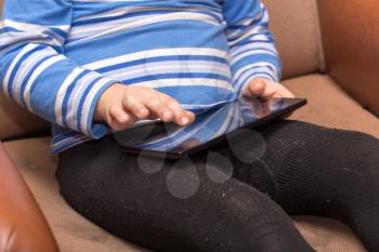 boy playing in a tablet