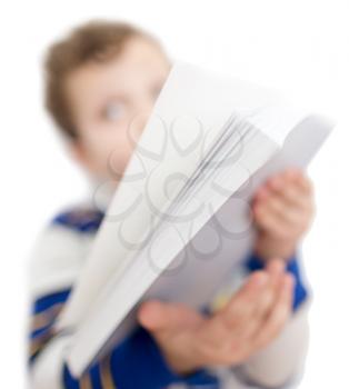 book in his hand, the boy on a white background