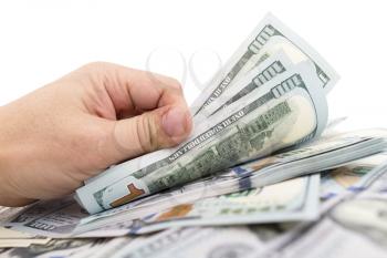 Dollars in hand on a white background