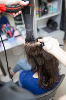 blow-drying in a beauty salon